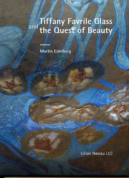 The cover for Lillian Nassau LLC's 2007 publication "Tiffany Favrile Glass and the Quest of Beauty", the cover showing an extreme close up of the surface of a favrile glass vase showing a motif of white floral millefiori decoration over an iridescent blue background