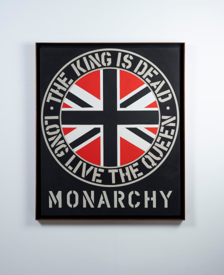 Monarchy, a black painting with its title painted in beige stenciled letters across the bottom. Above is a circle, with the Union Jack in the center, surrounded by a black ring with beige outlines. inside the ring is the beige stenciled text "The King is dead. Long live the Queen."
