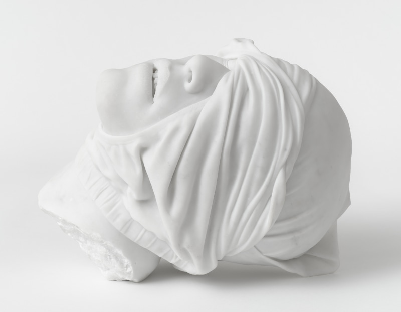 A sculpture by Reza Aramesh of a man's head wrapped in underwear in carrera marble.