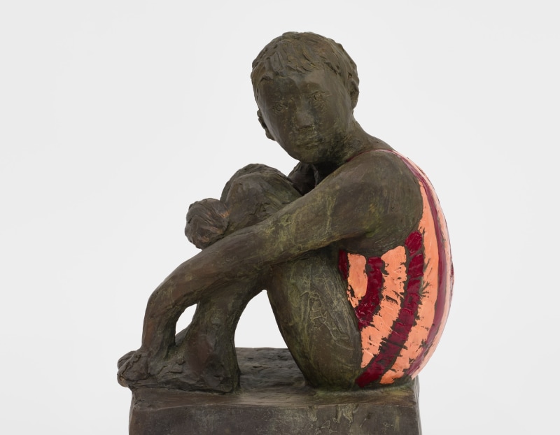 A bronze sculpture by Claire Tabouret of a child in a swimsuit