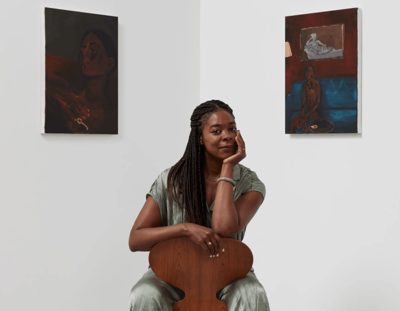 Artist Danielle McKinney with two of her paintings, Eternal, 2022, and Stay Put, 2022.Photo: Pierre Le Hors