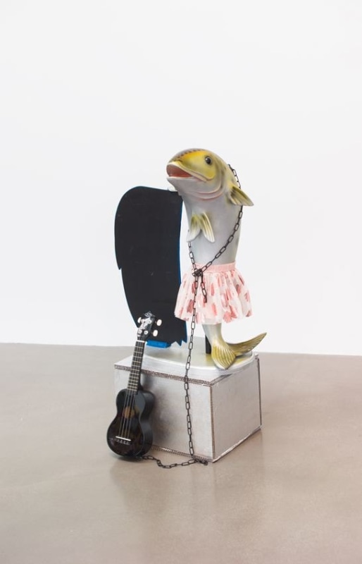 WHAT IF IT BARKS 6 (PETITE VERSION WITH BLACK UKULELE), 2018, Plastic, fabric, wood, cardboard pedestal, chain, ukulele