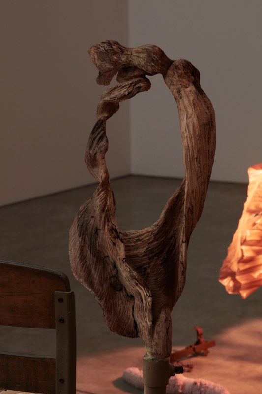Catalina Ouyang,&nbsp;&quot;debt&quot;, 2022, detail,&nbsp;found schoolchair, carved maple, polyester fleece, LED lights, paper collage, discarded garment rack, textile, resin, thread, plaster, epoxy clay, color pigment, beeswax, masking tape,&nbsp;37 x 60 x 38 in (94 x 152.4 x 96.5 cm)