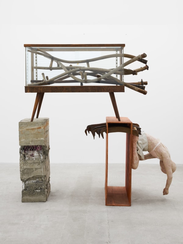 Cato Ouyang, &quot;Heads&quot;, 2024, mid-century display case, plywood, concrete, deconstructed scythes, papier-m&acirc;ch&eacute;, plaster, handmade eye, found textiles, artist&rsquo;s skirt, shaving mirror, 76 x 71 x 32 in (193 x 180.3 x 81.3 cm)