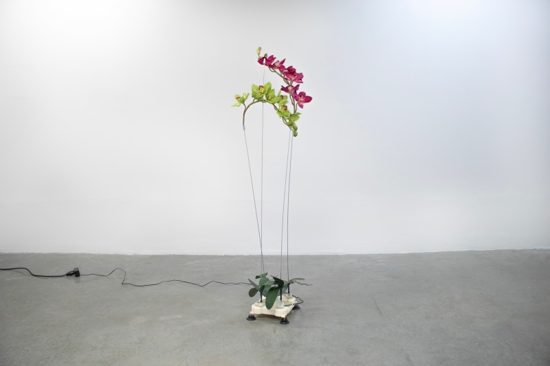 Rachel&nbsp;Youn, Fated, 2023, shiatsu massager, artificial flowers, steel, 57 x 14 x 16 in (144.8 x 35.6 x 40.6 cm)