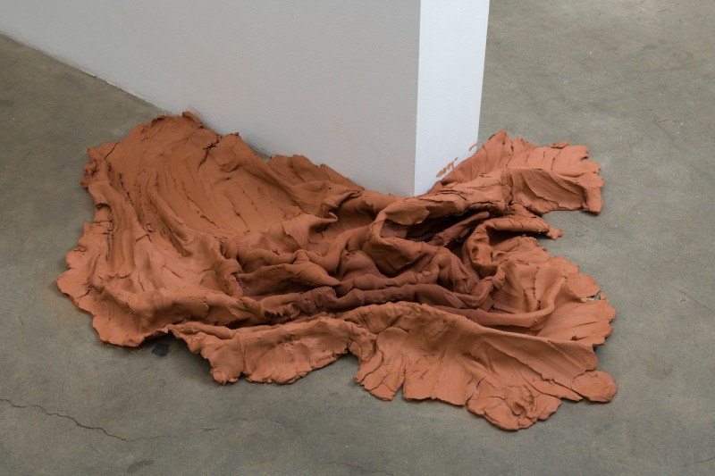 Brie Ruais, &quot;Pushed Aside, 135 lbs.&quot;, 2018, unfired red stoneware, 10 x 60 x 56 in (25.4 x 152.4 x 142.2 cm)