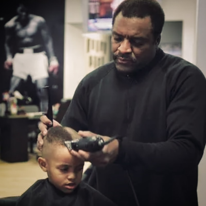 Zariff, Obama&amp;#39;s longtime barber, gives &amp;quot;the Obama&amp;quot; to 4-year-old Andre &amp;quot;A.J.&amp;quot; Evans,

which he describes as &amp;quot;low, youthful and joyous.&amp;quot;
