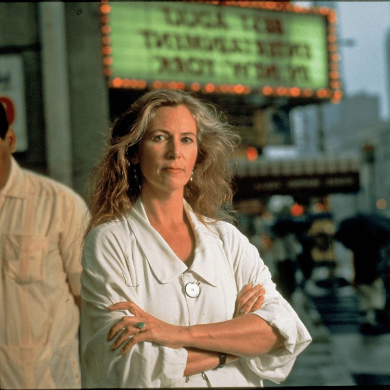 Catharine MacKinnon standing in front of a pornographic theater in Times Square in New York City, 1993.