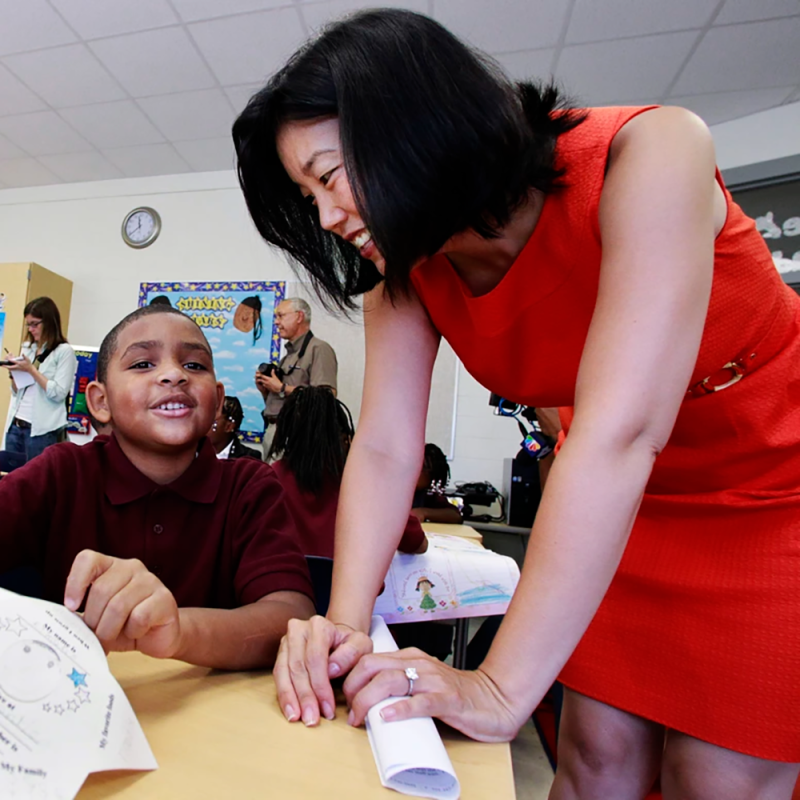 Former D.C.&amp;#39;s public schools chancellor, Michelle Rhee, talks to third grader Kmone Feeling during a visit at J.O. Wilson Elementary School on Aug. 23, 2010 in Washington. D.C.