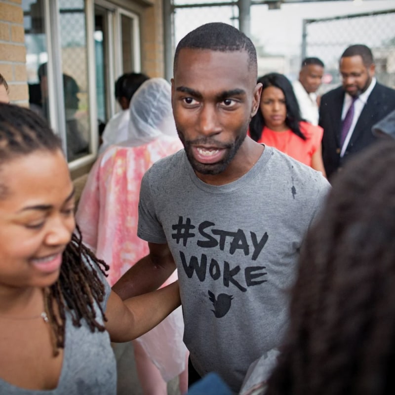 Black Lives Matter activist DeRay Mckesson walks out of the jail in Baton Rouge, La.