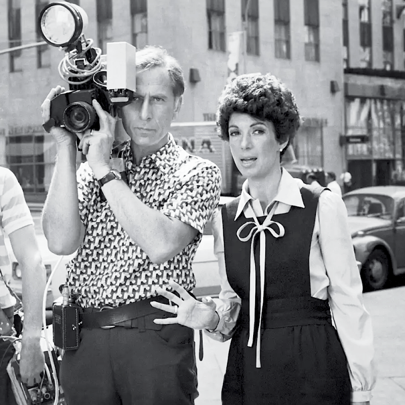 Journalist and author Betty Rollin discusses a shot with her cameraman, New York. September 6, 1977