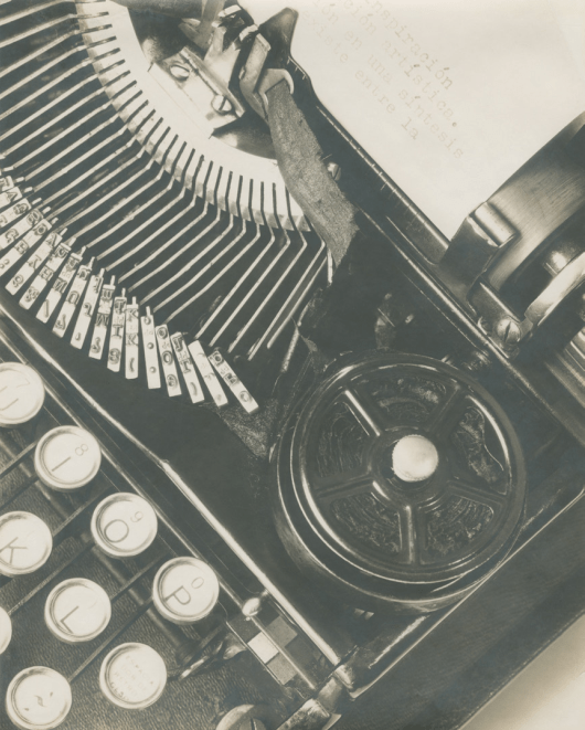 A typewriter photographed in black and white