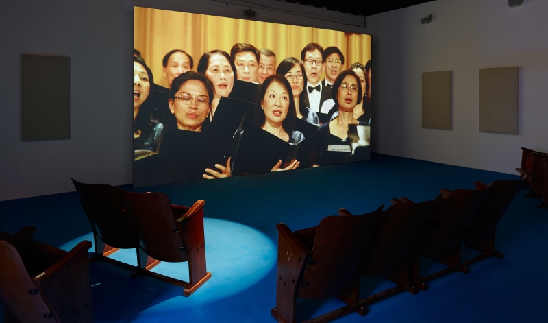 Installation view, We Are the World, as performed by the Hong Kong Federation of Trade Unions Choir in exhibition &quot;Samson Young: Songs for Disaster Relief&quot;, 57th Venice Biennale, 2017., &nbsp;