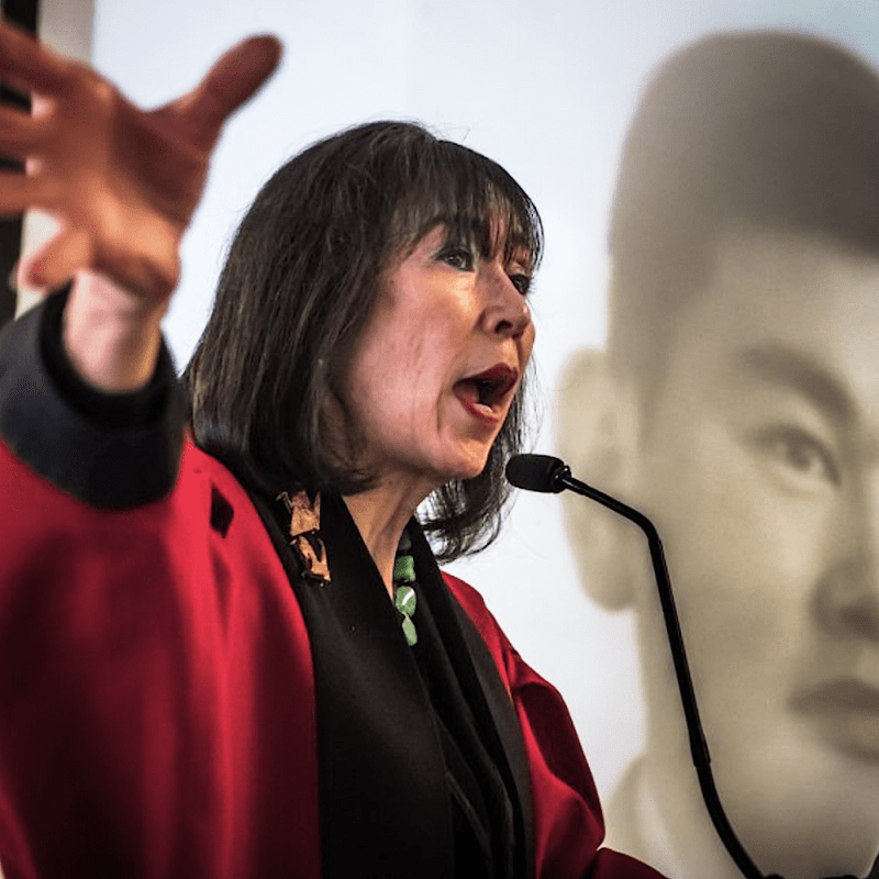 Karen Korematsu speaks to a crowd about her father, Fred Korematsu and his struggle against the racial profiling of Japanese American citizens during WWII.