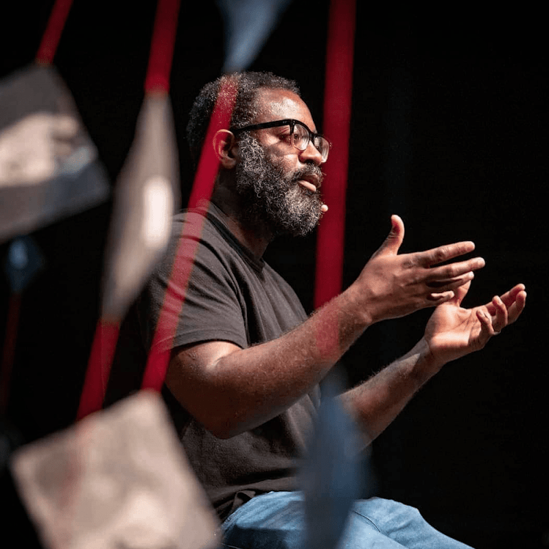 Reginald Dwayne Betts, critically acclaimed poet, author, and lawyer, answers questions from members of the audience during Q&amp;amp;A after his solo performance.