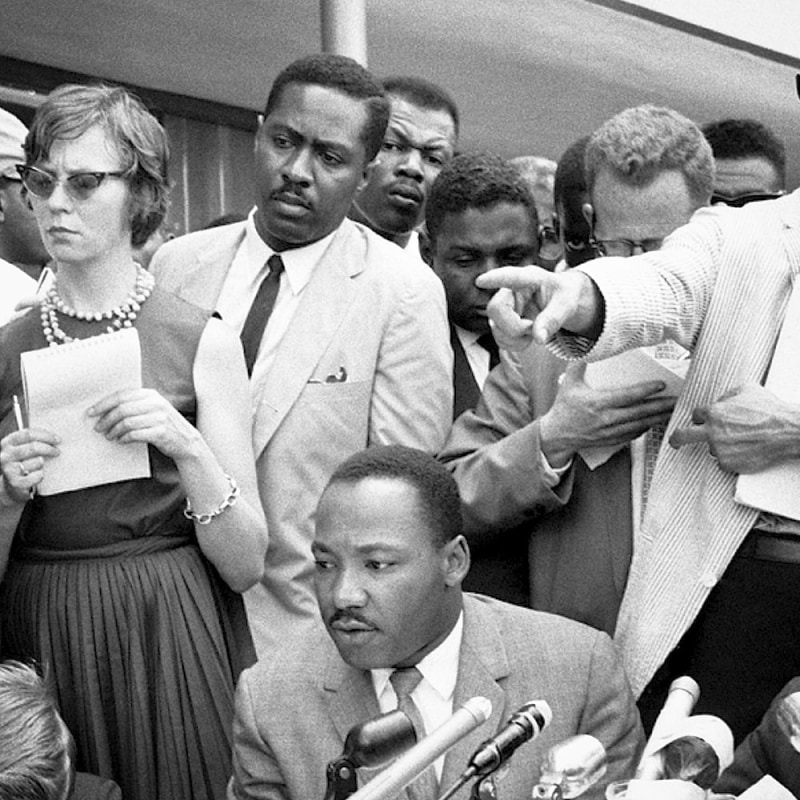 Martin Luther King, Jr., and Clarence B. Jones, his legal adviser (behind King) at a

press conference in Birmingham, AL, 1963.