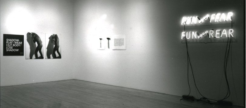 Installation view at Young Hoffman Gallery, Vito Acconci, Dara Birnbaum, Hans Haacke, Jenny Holzer, Joseph Kosuth, Sol LeWitt, Bruce Nauman, Lawrence Weiner, Group Exhibition, 1983