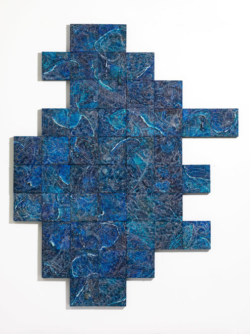 Blue marbled tiles form an irregular geometric shape on a white background