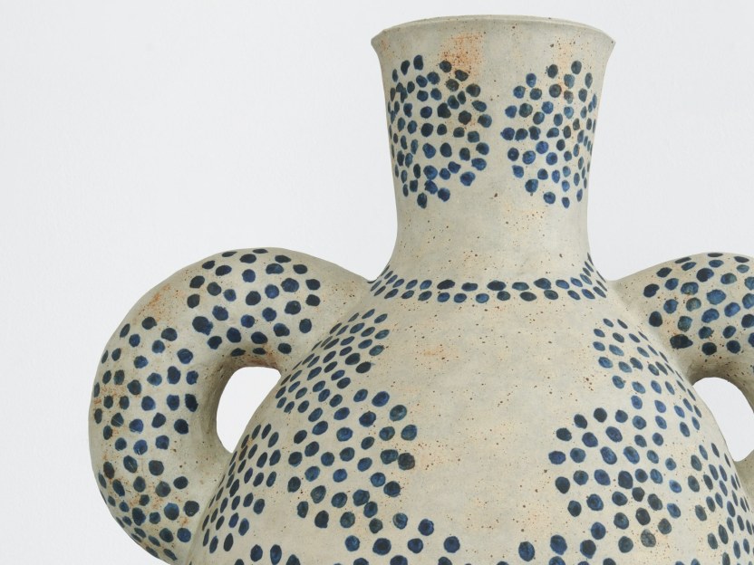 stoneware vessel with blue dot pattern