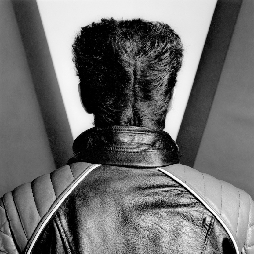 Self portrait from behind with hair in pompadour.