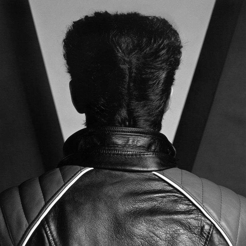 Self portrait from behind with hair in pompadour.