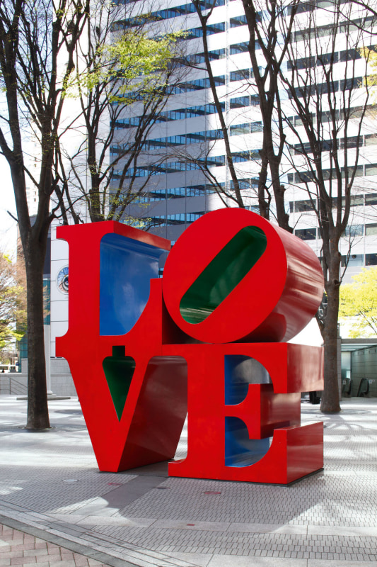 Robert Indiana's red, blue, and green polychrome aluminum LOVE sculpture on display in Tokyo