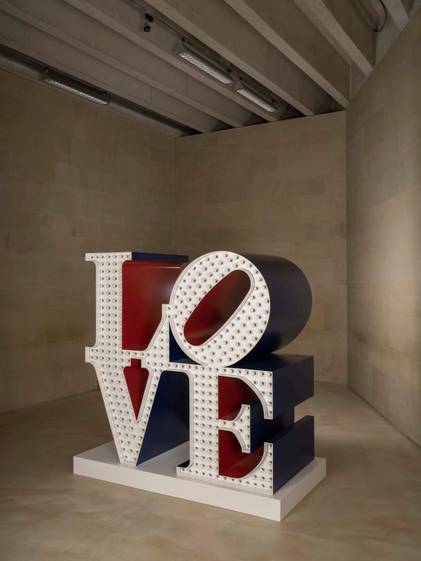 Robert Indiana's red, white, and blue sculpture Electric LOVE in the exhibition  Robert Indiana: Sculpture 1958–2018, at the Yorkshire Sculpture Park