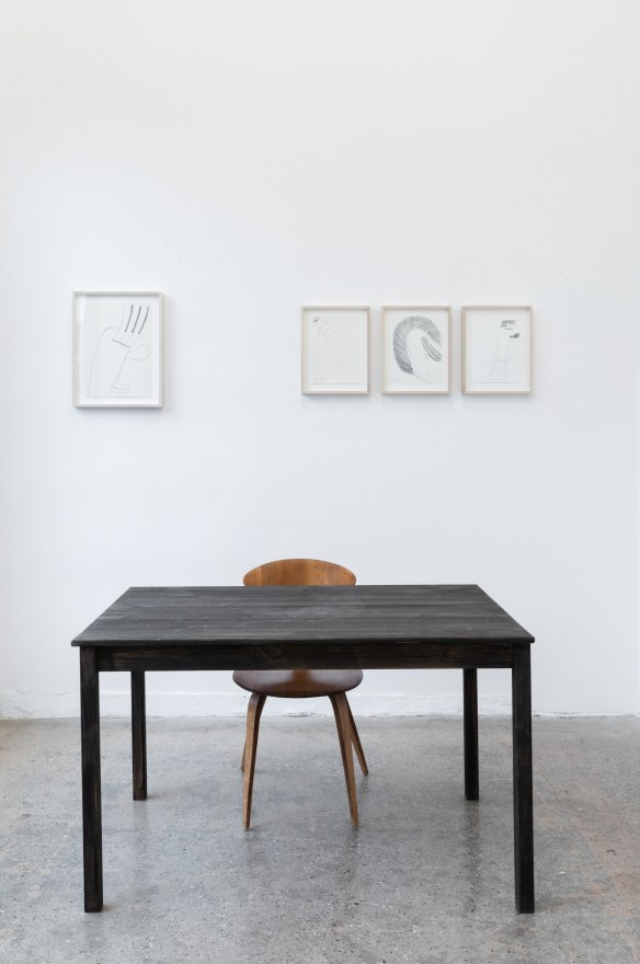 Installation View of &quot;Black Elk Speaks&quot;, a collection of drawings and a table and chair in the front room of Gallery 3
