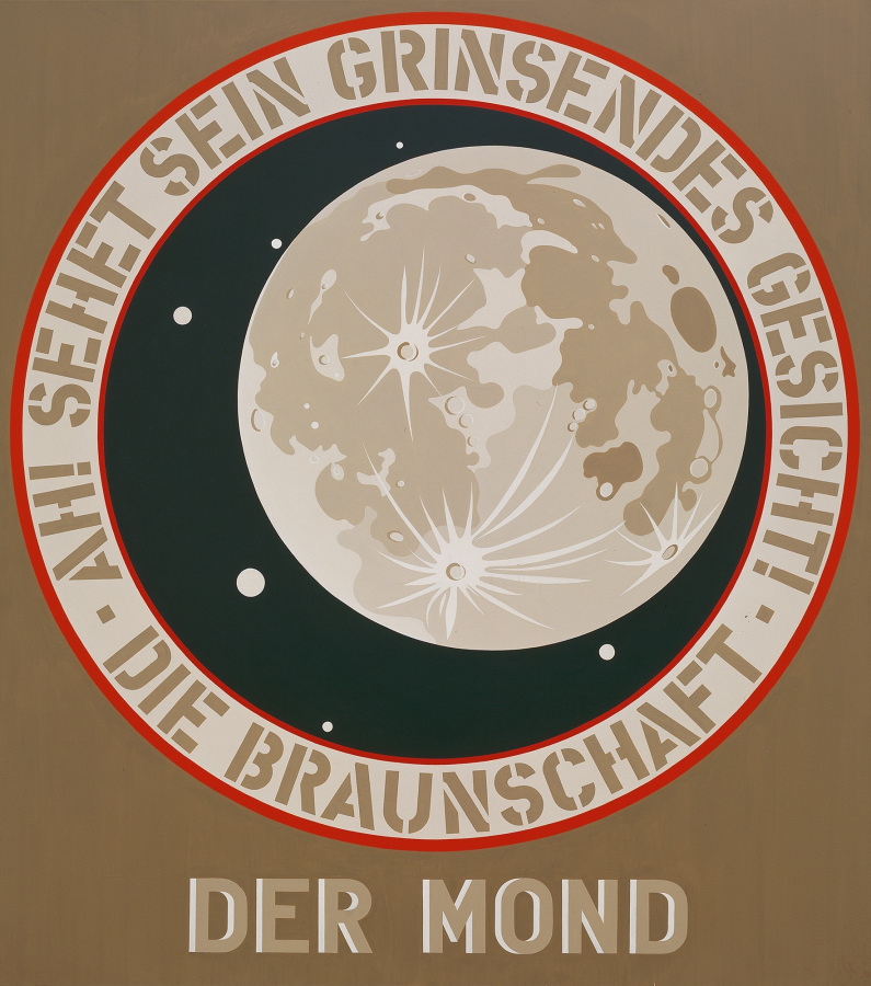 A painting with a light brown ground and dominated by a circle. The circle's red outlined ring contains the German text "Ah?! Sehet sein Grinsendes Gesicht, Die Braunschaft." Within the ring is a light brown moon against a black sky with a few scattered white dots. Der Mond is painted in tan letters across the bottom of the canvas.