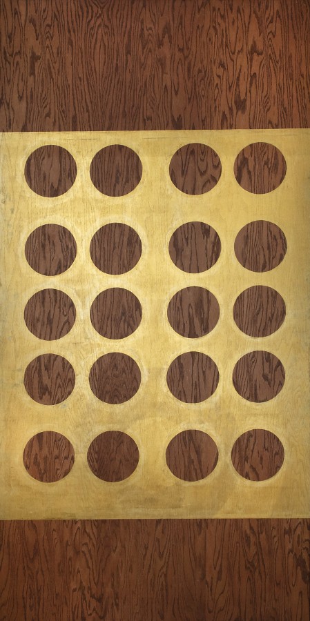 A painting with a gold rectangle that occupies the central two thirds of the panel and contains five horizontal rows of four orbs that reveal the plywood