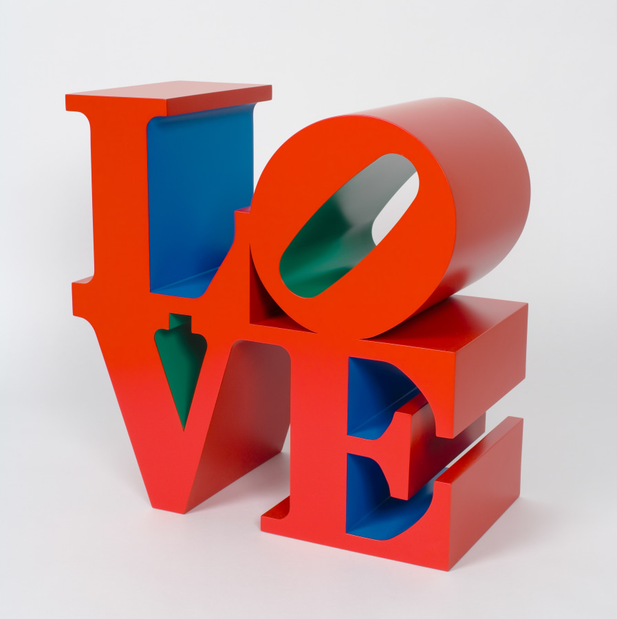 An 18 by 18 by 9 inch polychrome aluminum sculpture spelling love, consisting the letters L and a tilted letter O on top of the letters V and E. The faces and sides of the letters are red, the insides of the letters L and E are blue, and the insides of the letters O and V are green.