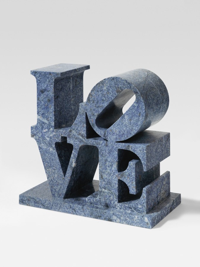 LOVE, a blue marble sculpture with the letter L and a tilted letter O sitting on top of the letters V and E.