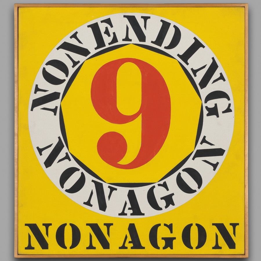 A painting with a yellow ground with the word "nonagon" been painted in black letters across the bottom of the canvas. Above this is a yellow nonagon containing a red numeral nine. Surrounding this is a white ring with the text "nonending nonagon" painted in black.