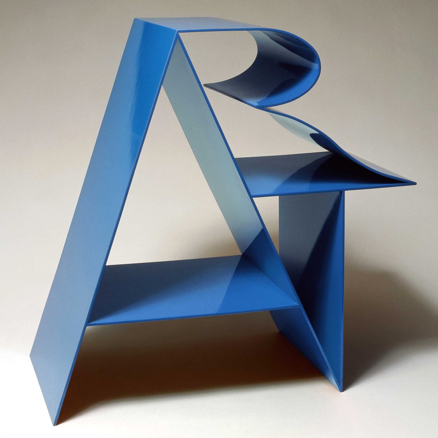 Art, an 18 by 18 by 9 inch blue polychrome aluminum sculpture. The letter "A” forms a supporting structure that the “R” and “T” lean against.