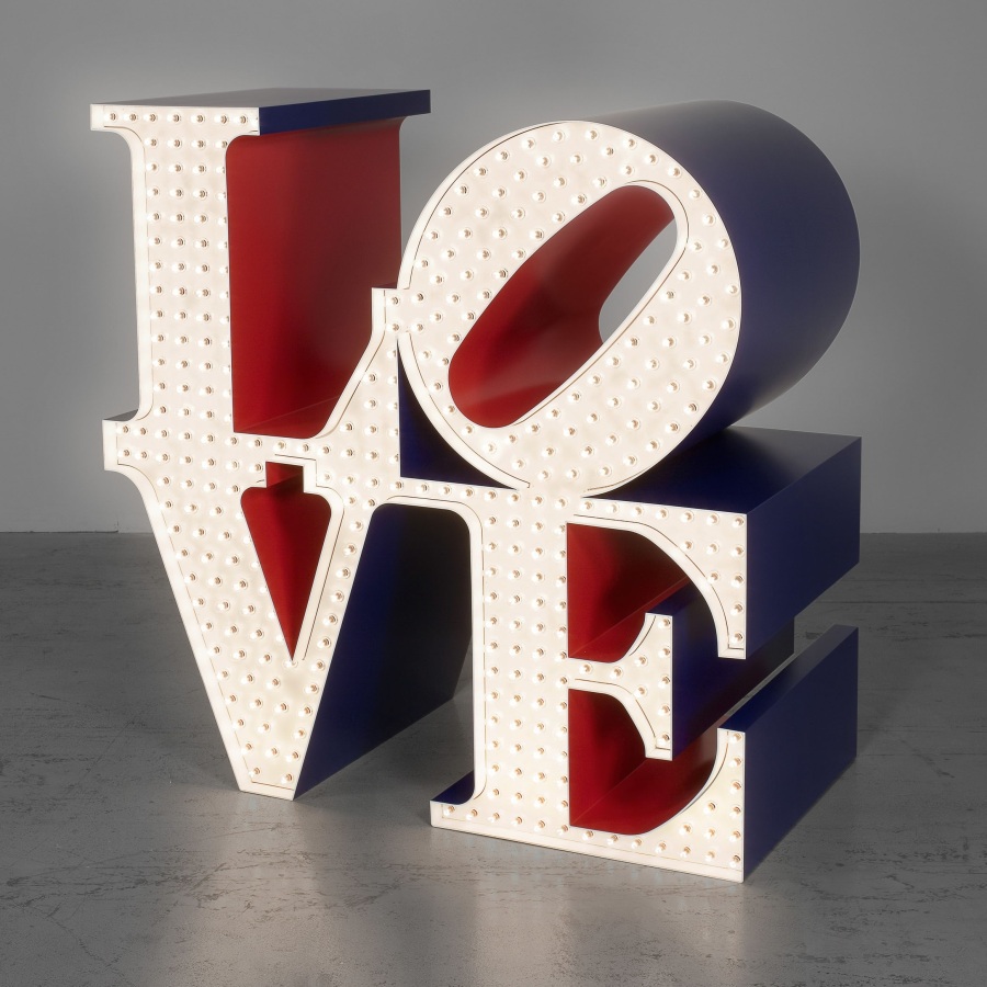 The Electric LOVE, a 72 inch polychrome aluminum sculpture consisting of the letter L and a tilted O atop of a V and E. The face of the sculpture is white, and has lights that flash on and off. The sides of the sculpture are blue, and the insides red.