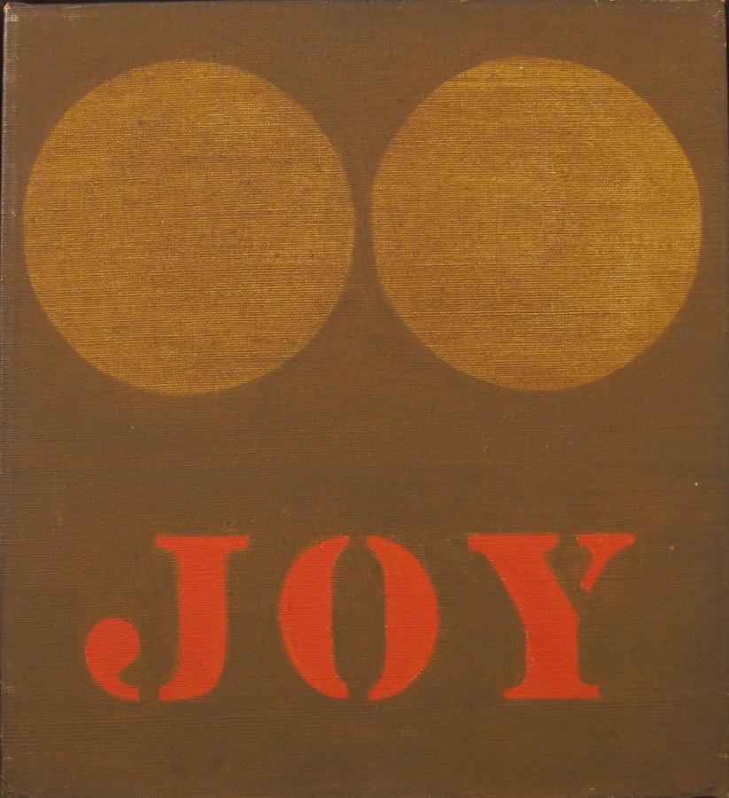 A painting consisting of two light brown orbs above the work Joy, painted in red, against a darker brown ground