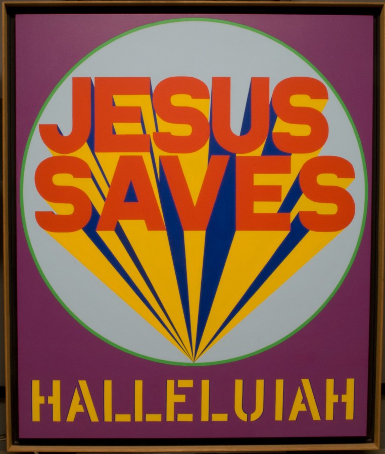 A painting purple background the the title, Halleluiah, painted in yellow stenciled letters across the bottom of the painting. Above the title is a light blue circle with a green outline. Inside the circle "Jesus Saves" has been painted in red-orange letters, with rays of yellow and blue emanating from behind the letters.
