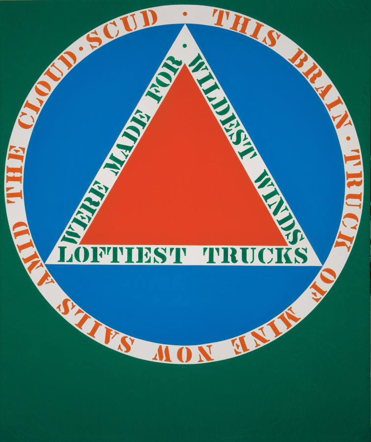 A painting consisting of a large circle against a green background. In the center of the blue circle is a red triangle, surrounded by the stenciled green against white text "loftiest trucks were made for wildest winds." Red stenciled text in a white ring surrounding the circle reads "this brain truck of mine now sails amid the cloud scud"