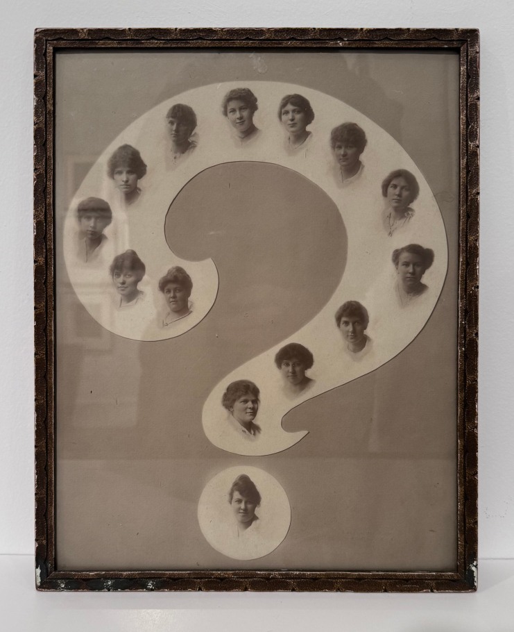 MOUNTED SILVER GELATIN PRINT IN THE SHAPE OF “?” WITH 14 PORTRAITS OF YOUNG WOMEN LIKELY A CLASS FROM A GIRLS SCHOOL