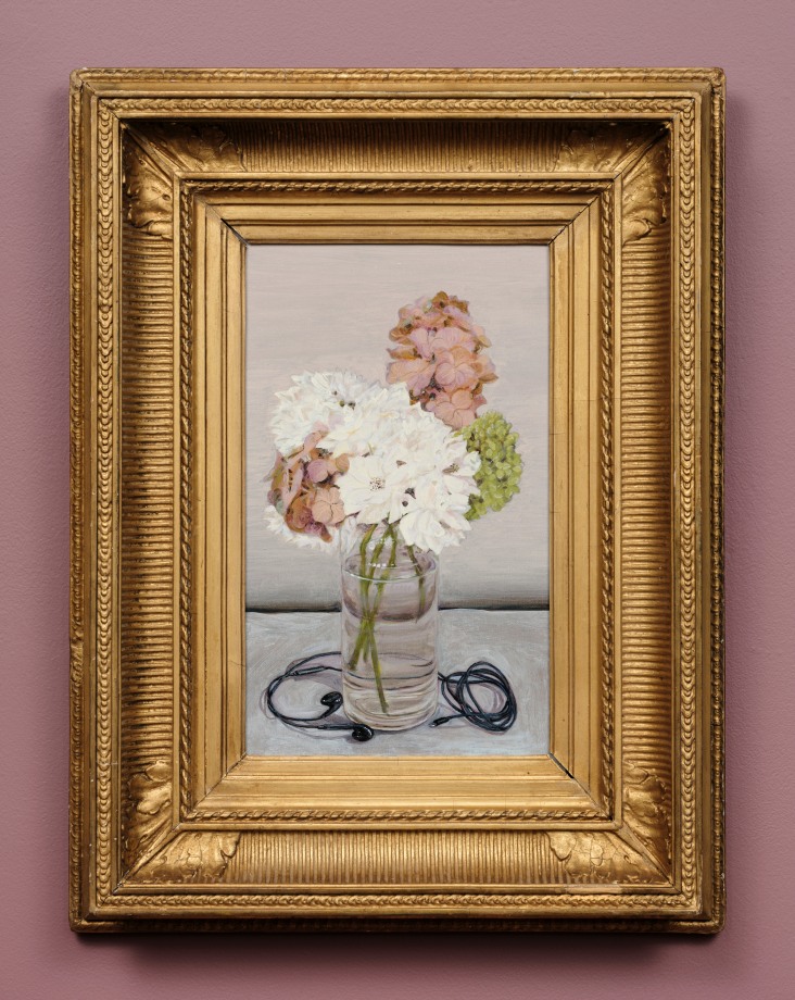 Still life of a vase of flowers with earphones