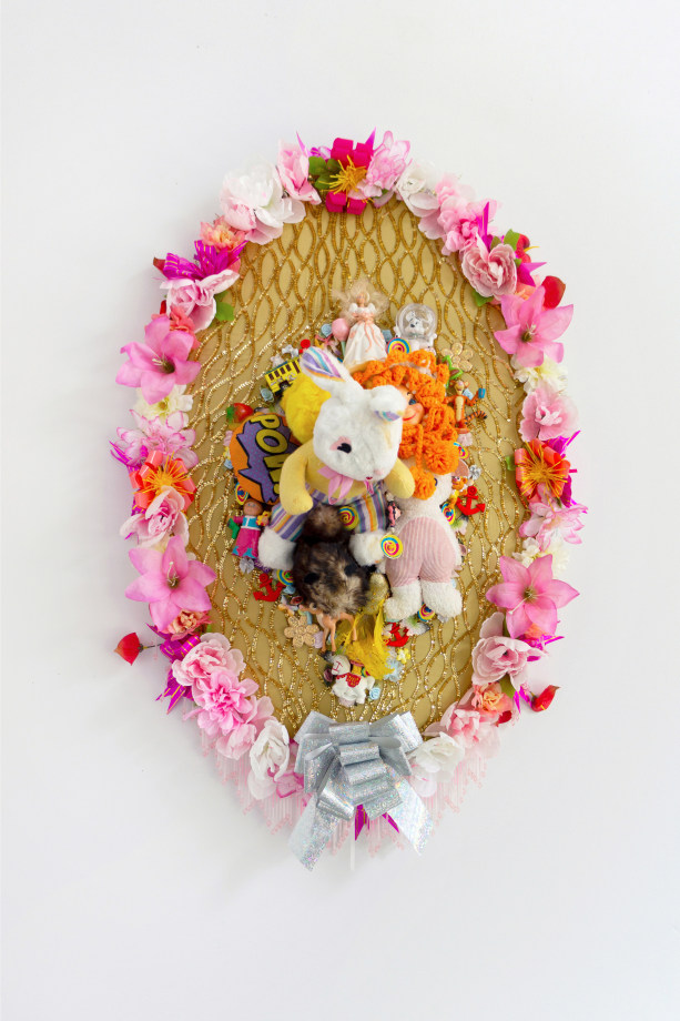 Max Colby, Elegy 17, 2020,&nbsp;Found fabric, trim, fabric flowers, ribbon, patches, toys, garland, polyester batting, MDF, thread,&nbsp;44 x 30 x 15 in (111.76 x 76.2 x 38.1 cm), &nbsp;