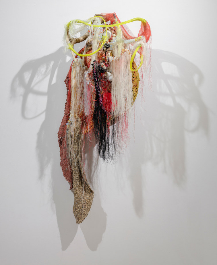 Rina Banerjee, The earth as a company grows octopi of tentacles rich on weavers, ancillary craft man, raw materials syphoned into the cities for a final urban display, where mercantile pleasures., 2020,&nbsp;Beads, shells, fabric, metal, mirrors, plastic, thread,&nbsp;47 x 15.5 x 13.5 in (119.4 x 39.4 x 34.3 cm), &nbsp;