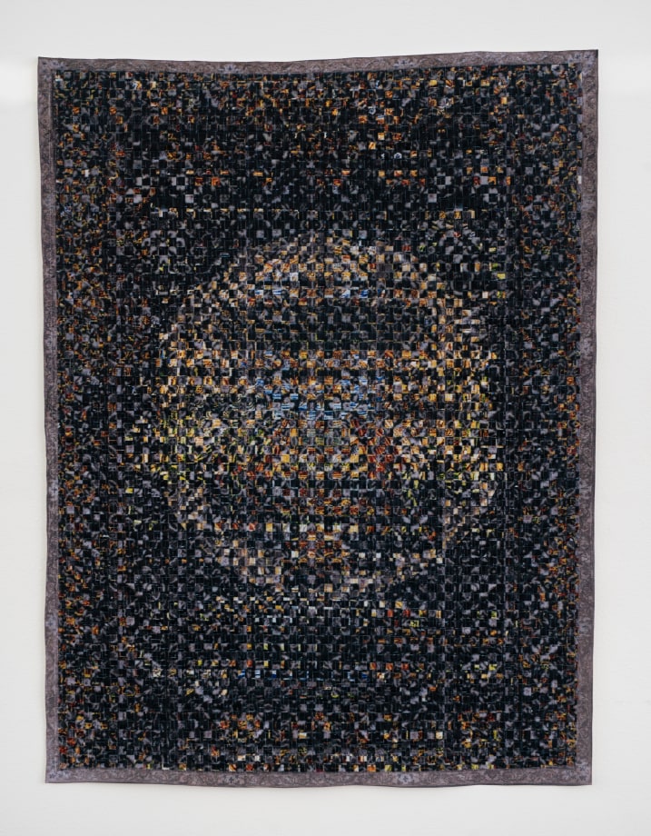 Woven paper artwork reminiscent of an oriental rug and stained glass windows