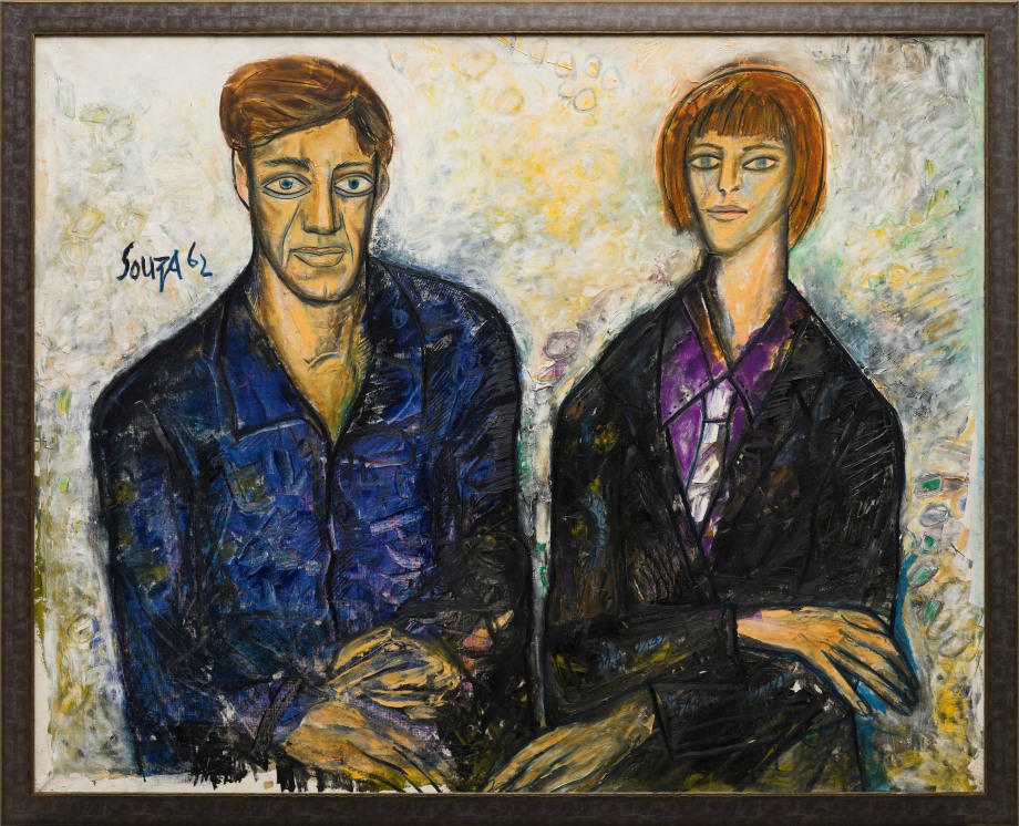 Portrait of a couple sitting on a light background