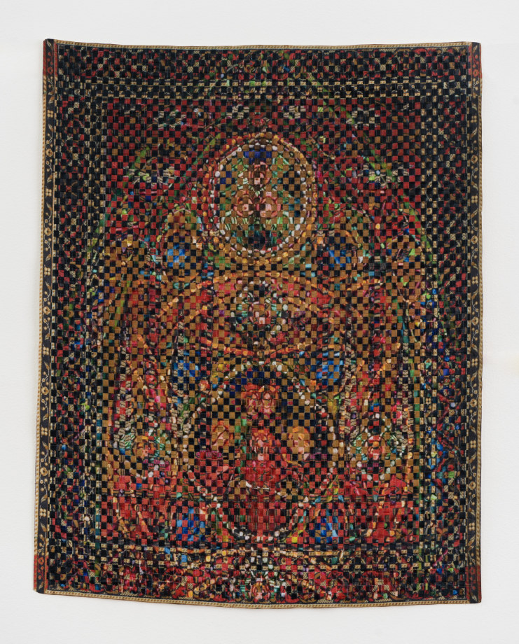 Woven paper artwork reminiscent of an oriental rug and stained glass windows