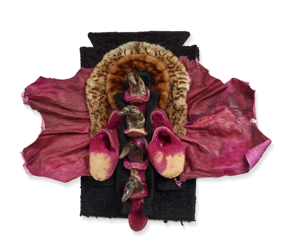 Wall sculpture made from animal skin, fur, shoes, horns and cloth