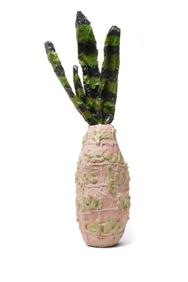 Sculpture of a vase with a snake plant