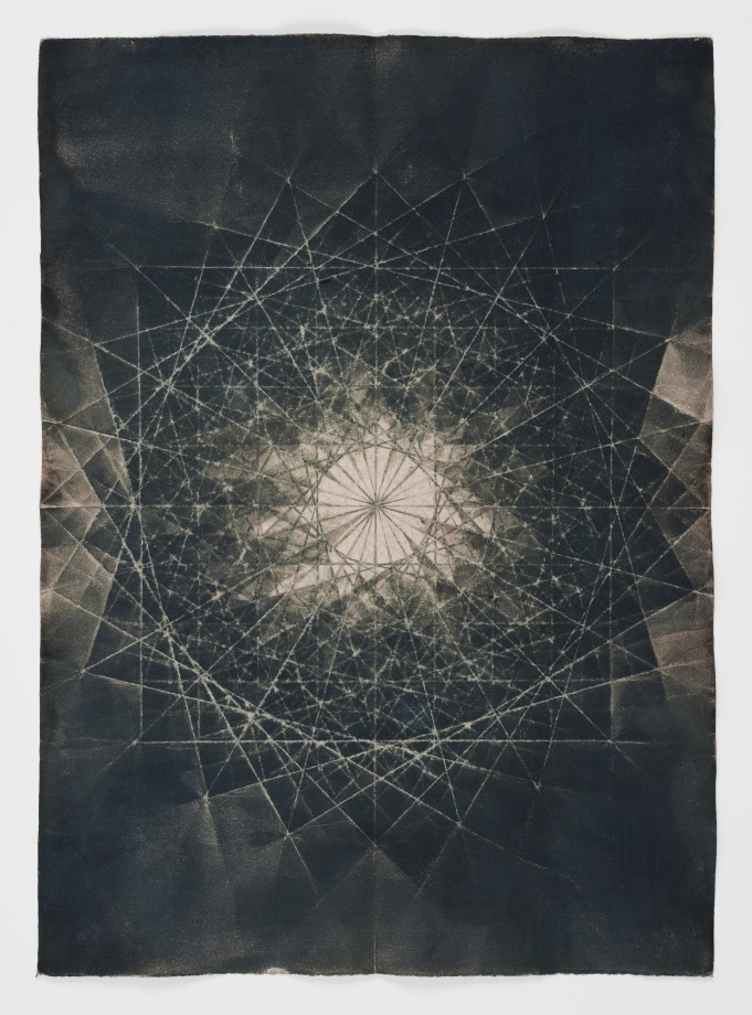 Abstract black and white geometric shapes via cyanotype dyed with yerba mate tea on folded paper