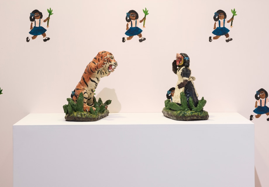 Sculptures of a Tiger and Sanbras facing each other