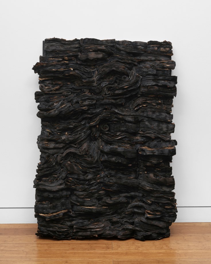 Sculpture created using half-burned books